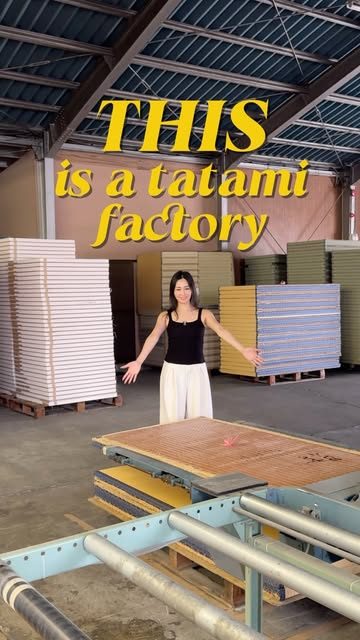 Inside a tatami factory, mats stacked to the rafters